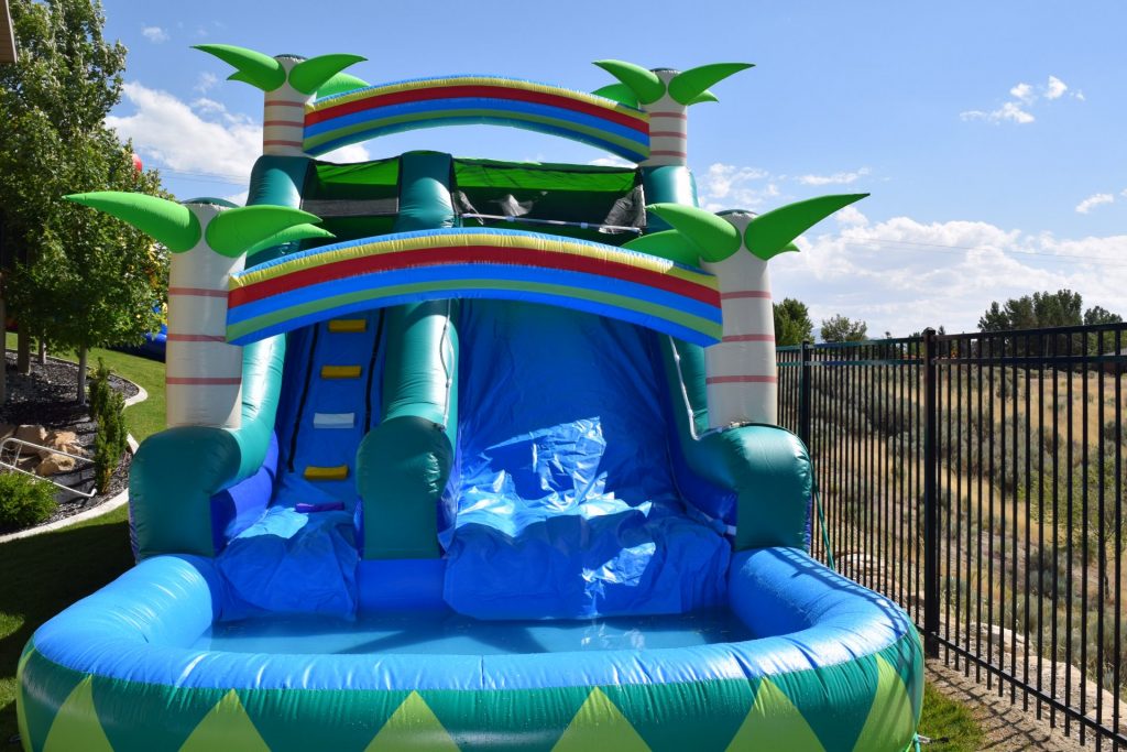 inflatable water slide with palm trees