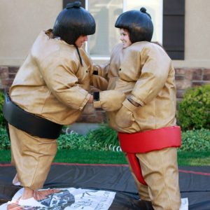 2 kids in Sumo Wrestling inflatable suits