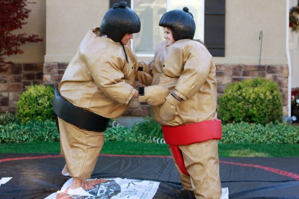 2 kids in Sumo Wrestling inflatable suits